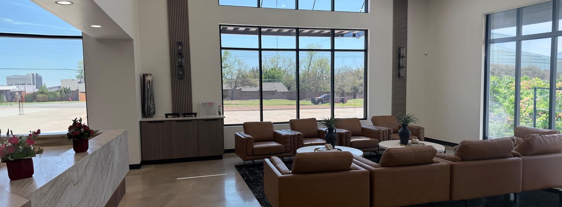 The image shows a modern dental clinic interior with various pieces of equipment, including a dental chair and an X-ray machine.