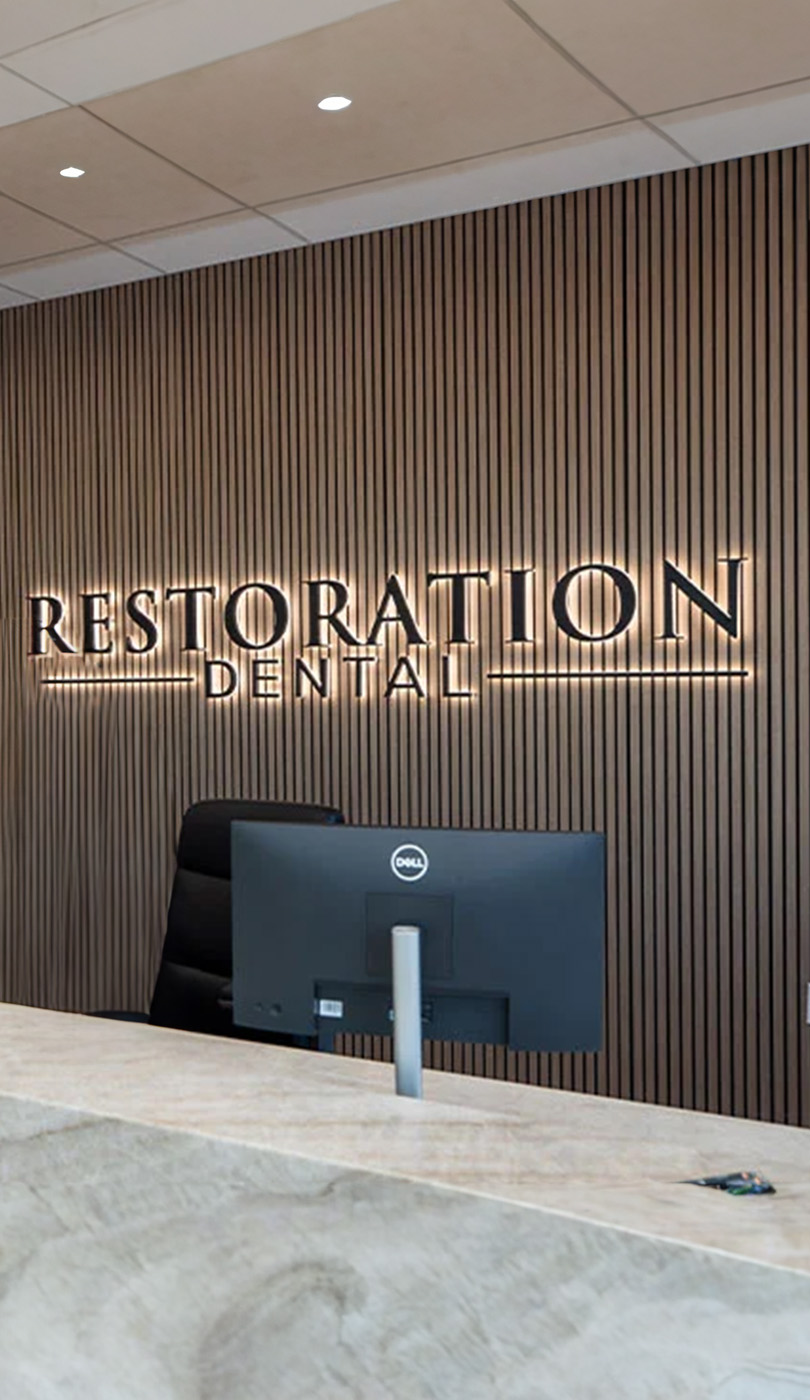 The image shows a modern dental or medical office interior with a dental chair, equipment, and a clean, professional environment.